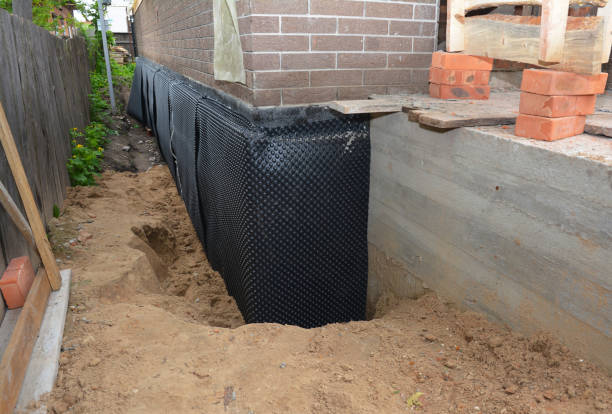 Happy homeowners after waterproofing job in Cecil